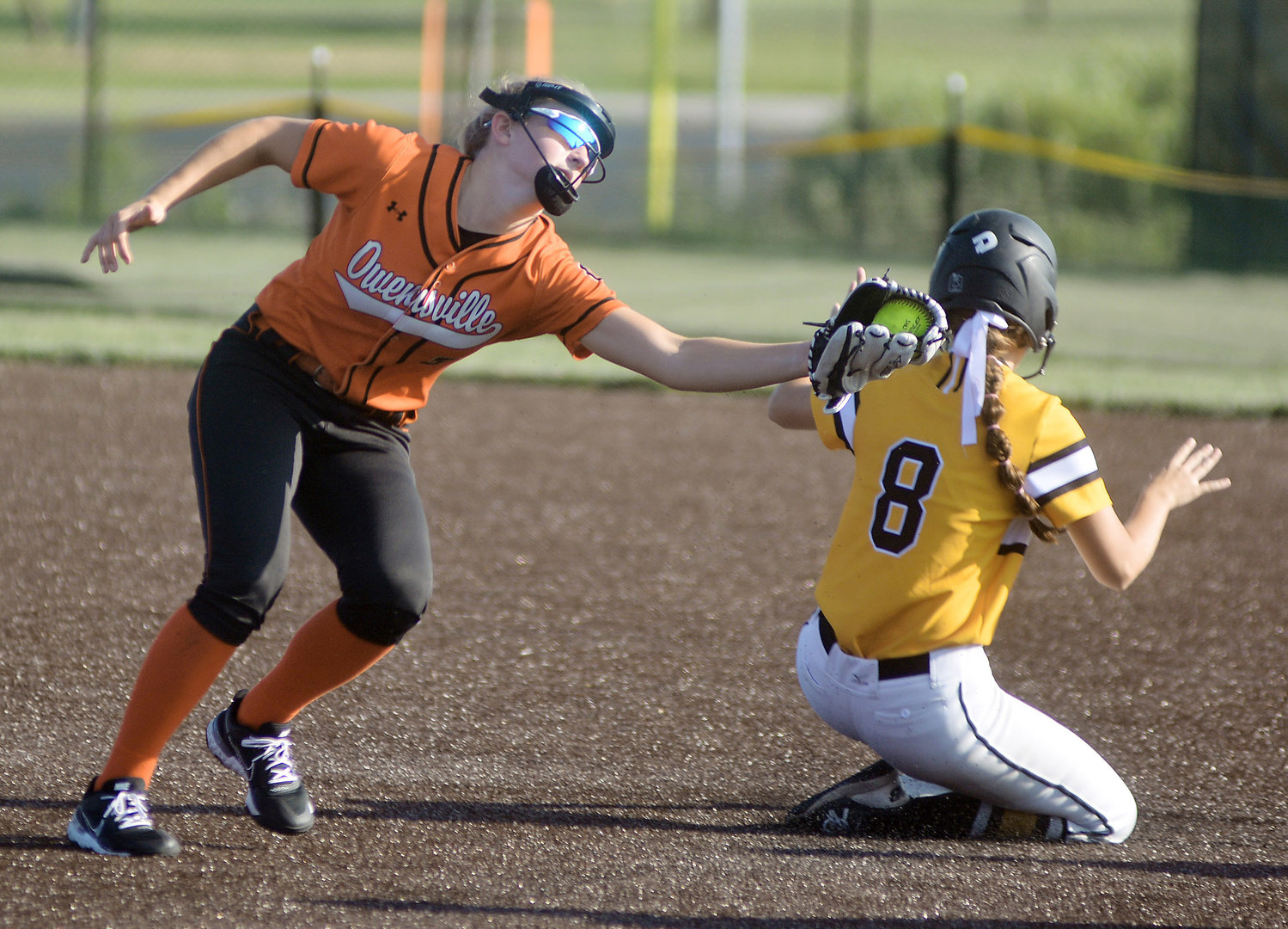 Anna Finley (above, left) narrowly misses tagging out Sullivan’s Grace Halmich stealing second base during home softball action at OHS Field between the Owensville Dutchgirls and Lady Eagles.